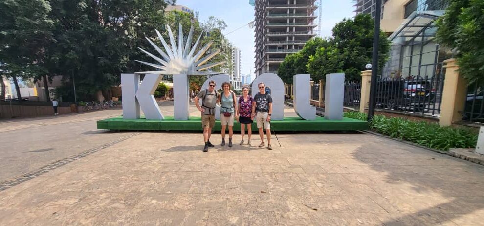 Travelers at a Kigali city landmark in Rwanda